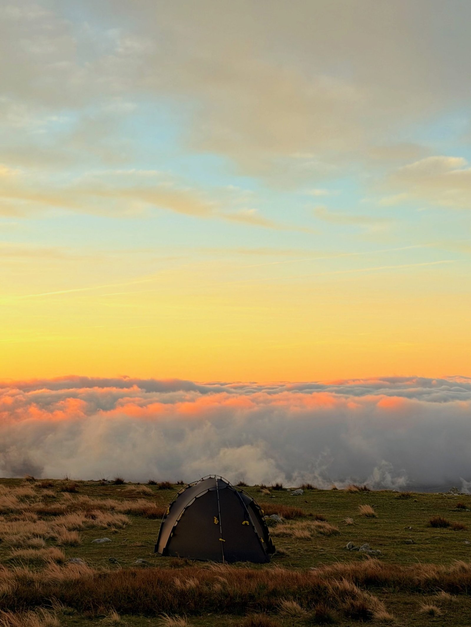 Morgan's tent above a glowing sea of cloud near Glyder Fawr and Castell y Gwynt